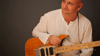 guitar teacher Ian Dyball with electric guitar